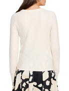 Cream garter knit crew neck sweater, long sleeves with ribbed cuffs and neckline.