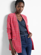 Red and pink striped cardigan with dark trim. Open front, long sleeves.