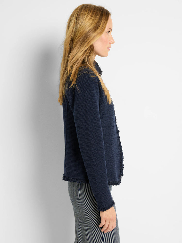 Navy blue knit jacket with fringe trim. Notch collar.  Textured fabric.