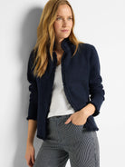 Navy blue knit jacket with fringe trim.  Notch collar.