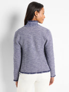 Blue and white textured knit jacket with a high notched collar and frayed edges. Rear view.