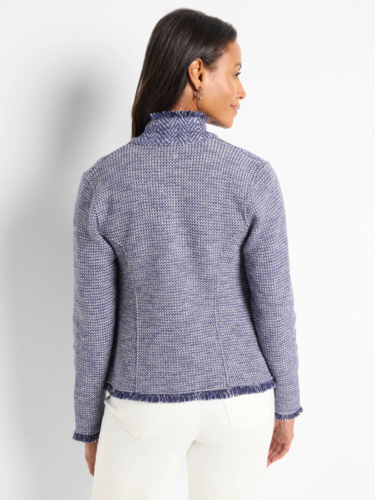Blue and white textured knit jacket with a high notched collar and frayed edges. Rear view.