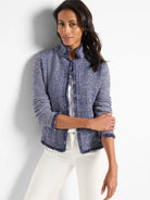 Navy blue and white herringbone knit jacket with fringe trim. Notch collar.