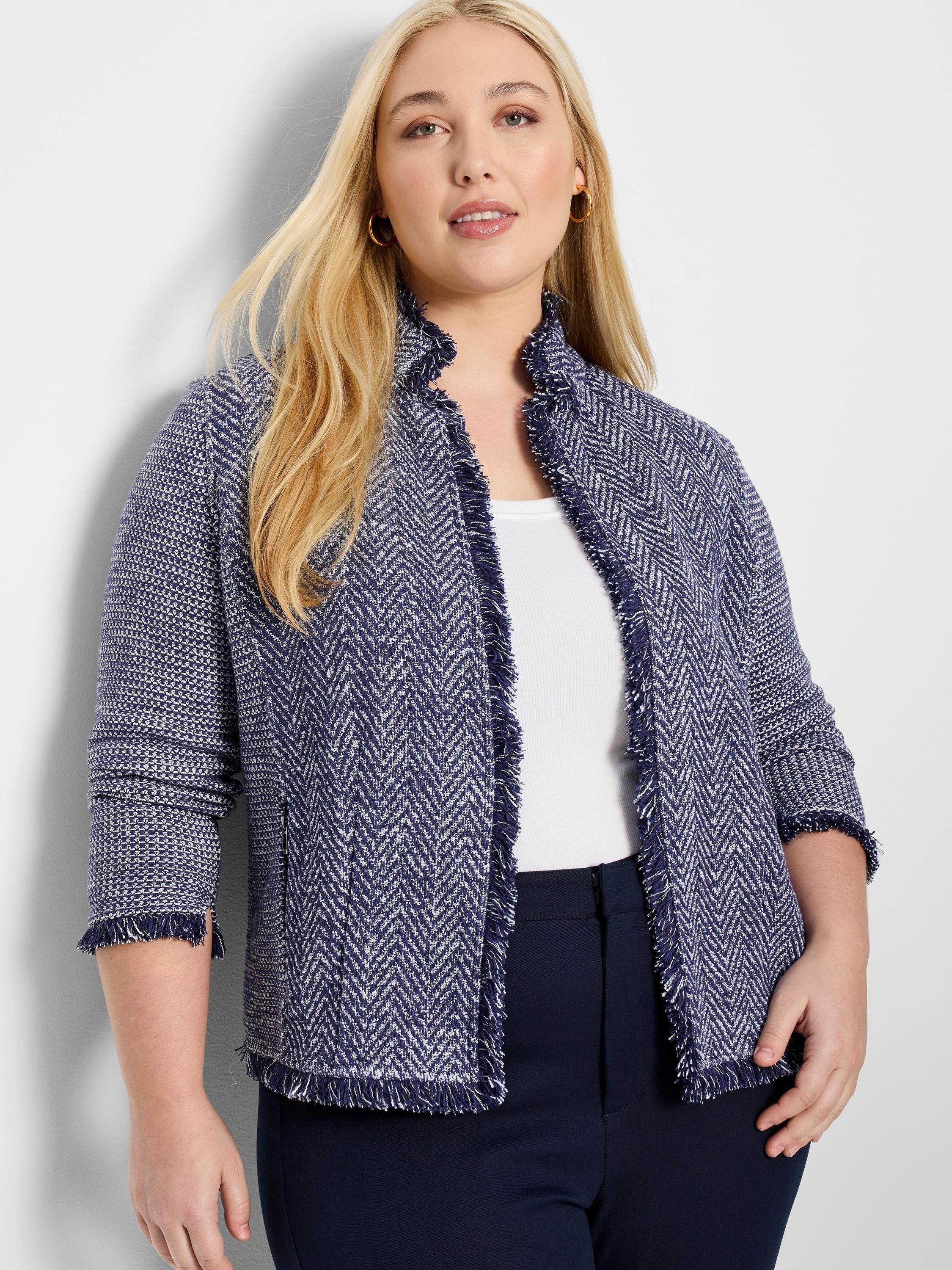 Navy blue and white herringbone knit jacket with fringe trim.  Three-quarter sleeves. Notch collar.