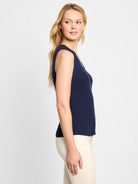 Navy blue sleeveless ribbed knit sweater vest with front buttons.