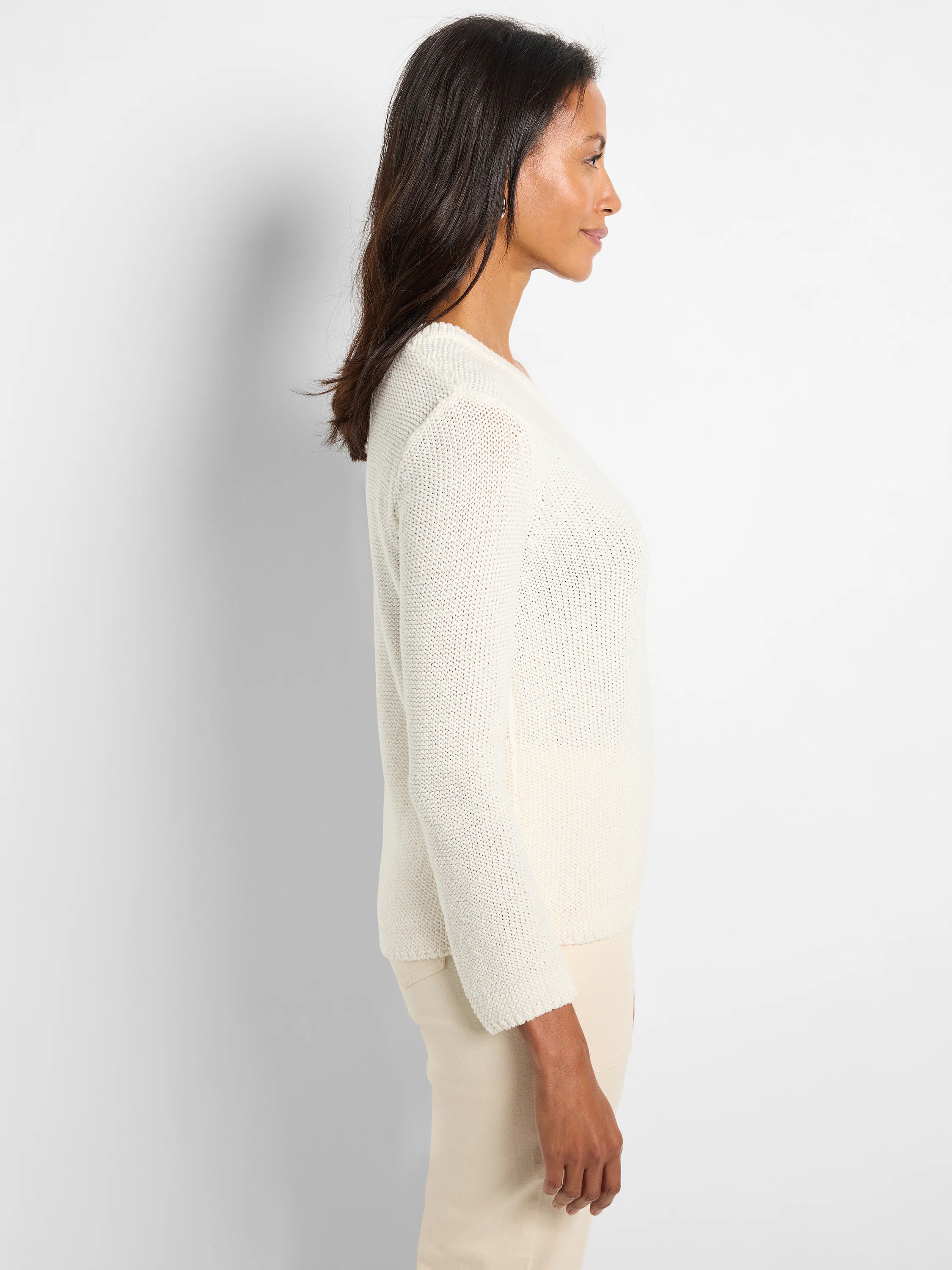 Off-white, loosely knit sweater.  Long sleeves, crew neckline.