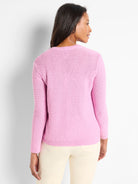Pink crewneck sweater, long sleeves, textured knit.  Back view.