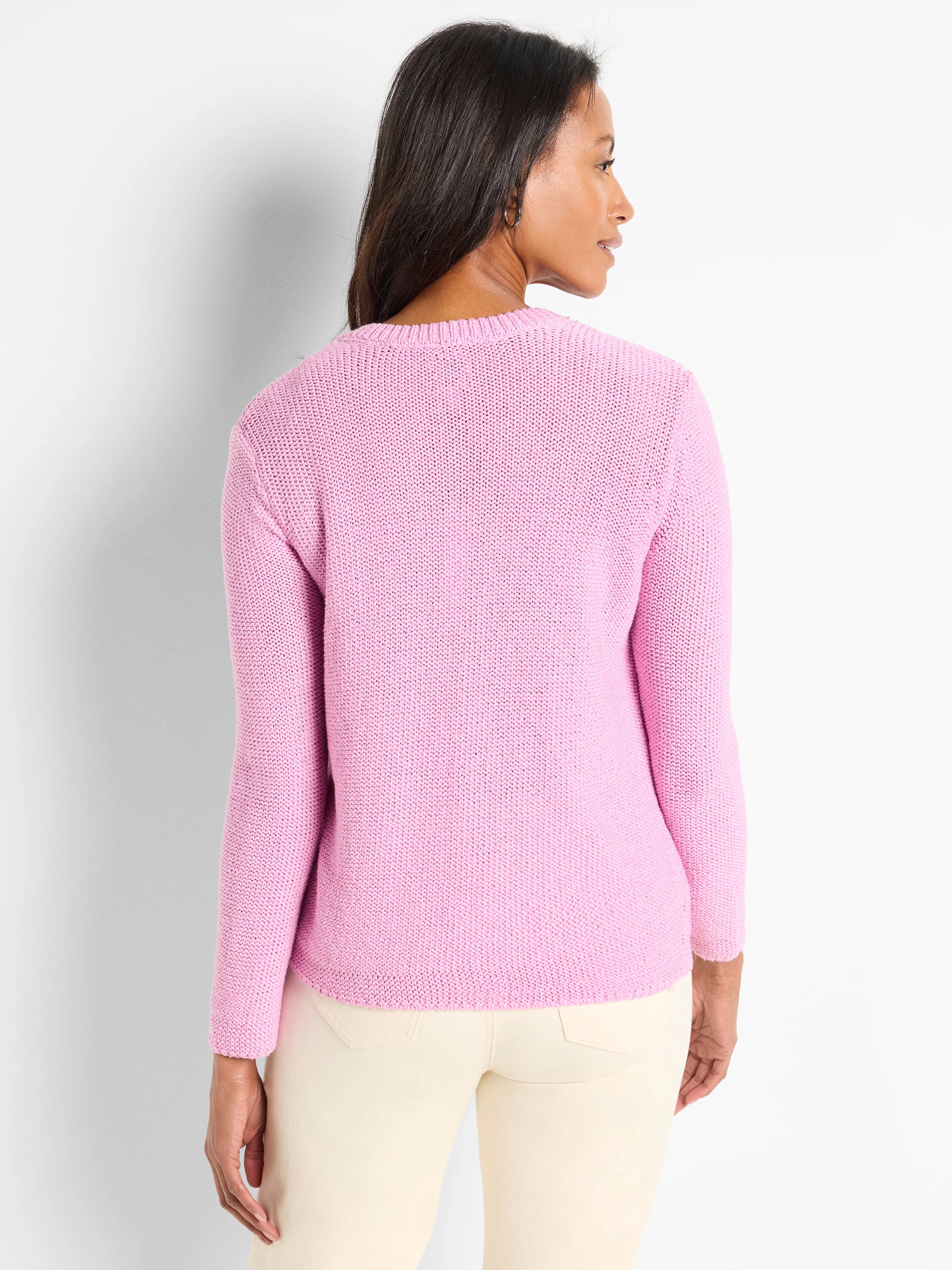 Pink crewneck sweater, long sleeves, textured knit.  Back view.