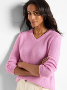 Light pink, V-neck, long-sleeved sweater; textured knit.