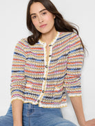 Crochet knit jacket with multicolored stripes in yellow, orange, pink, blue, and white.  Button front.