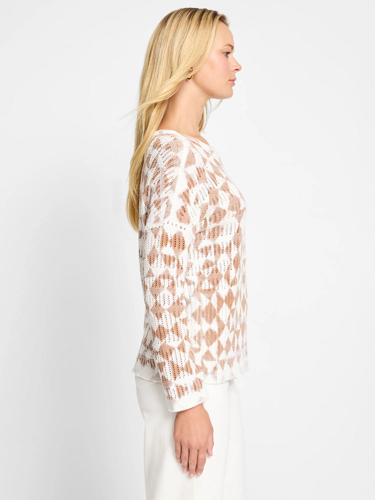 Off-white sweater with light brown textured diamond pattern. Long sleeves.