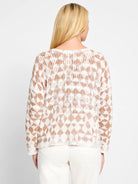 Off-white sweater with a taupe diamond pattern.  Open knit texture.