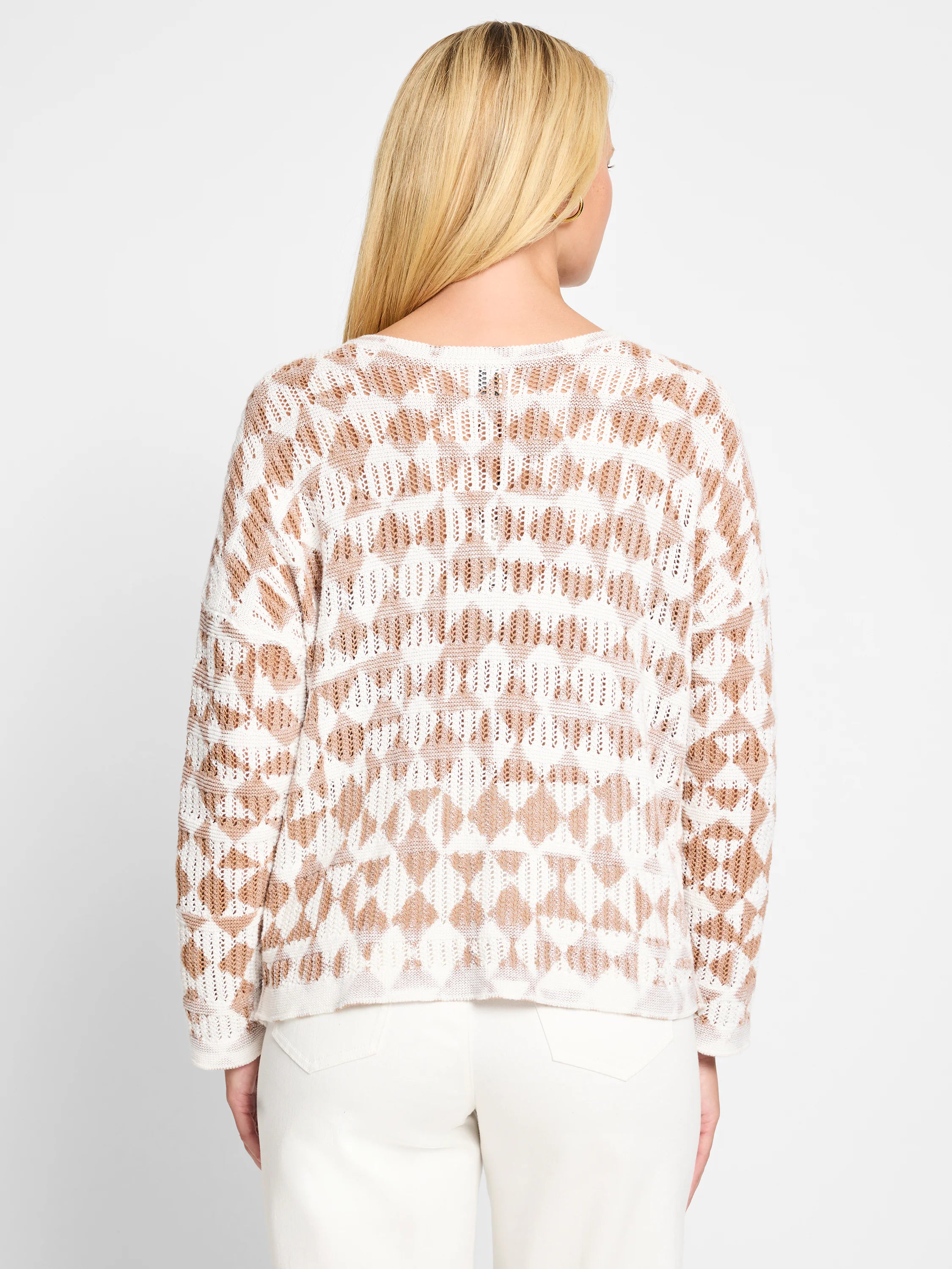 Off-white sweater with a taupe diamond pattern.  Open knit texture.