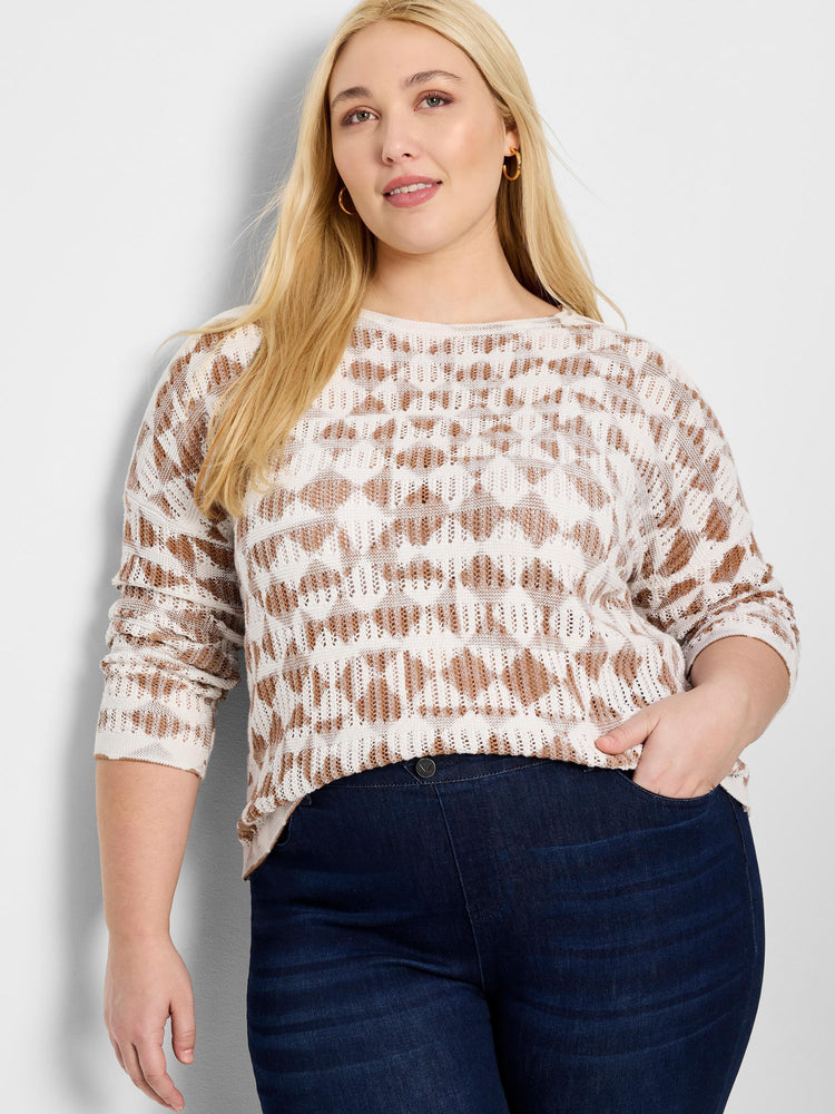 Cream-colored sweater with brown textured diamond pattern.  Long sleeves, crew neck.