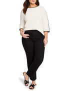 Off-white ribbed sweater with black and light green trim at neckline and sleeves.  Three-quarter sleeves.