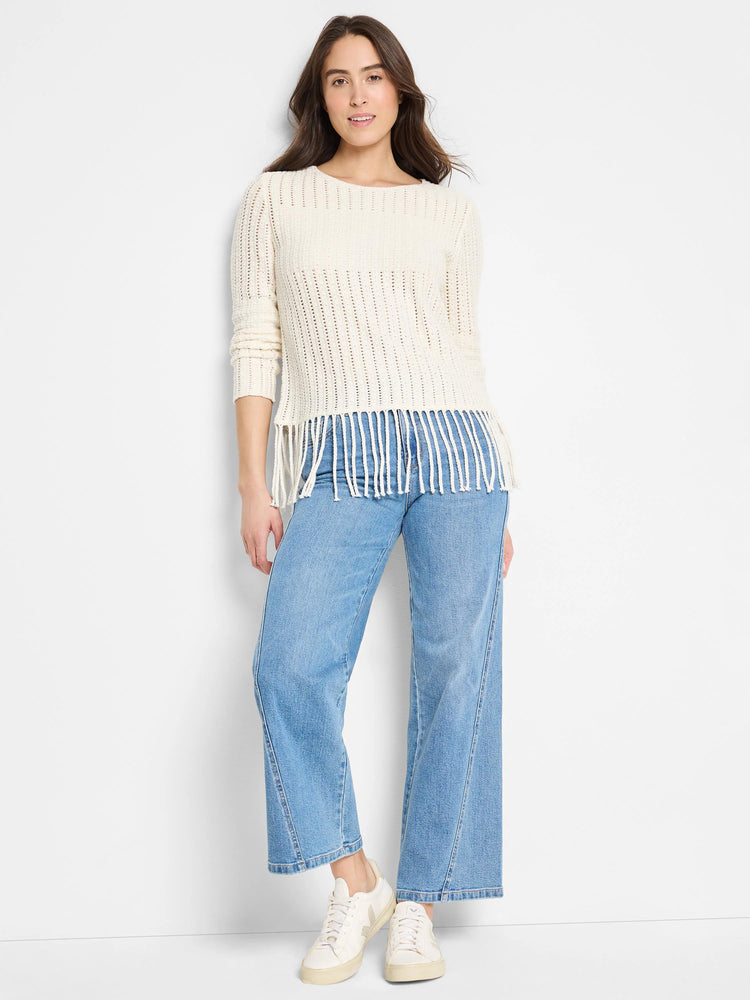 Off-white open-knit sweater with fringe bottom.  Long sleeves.