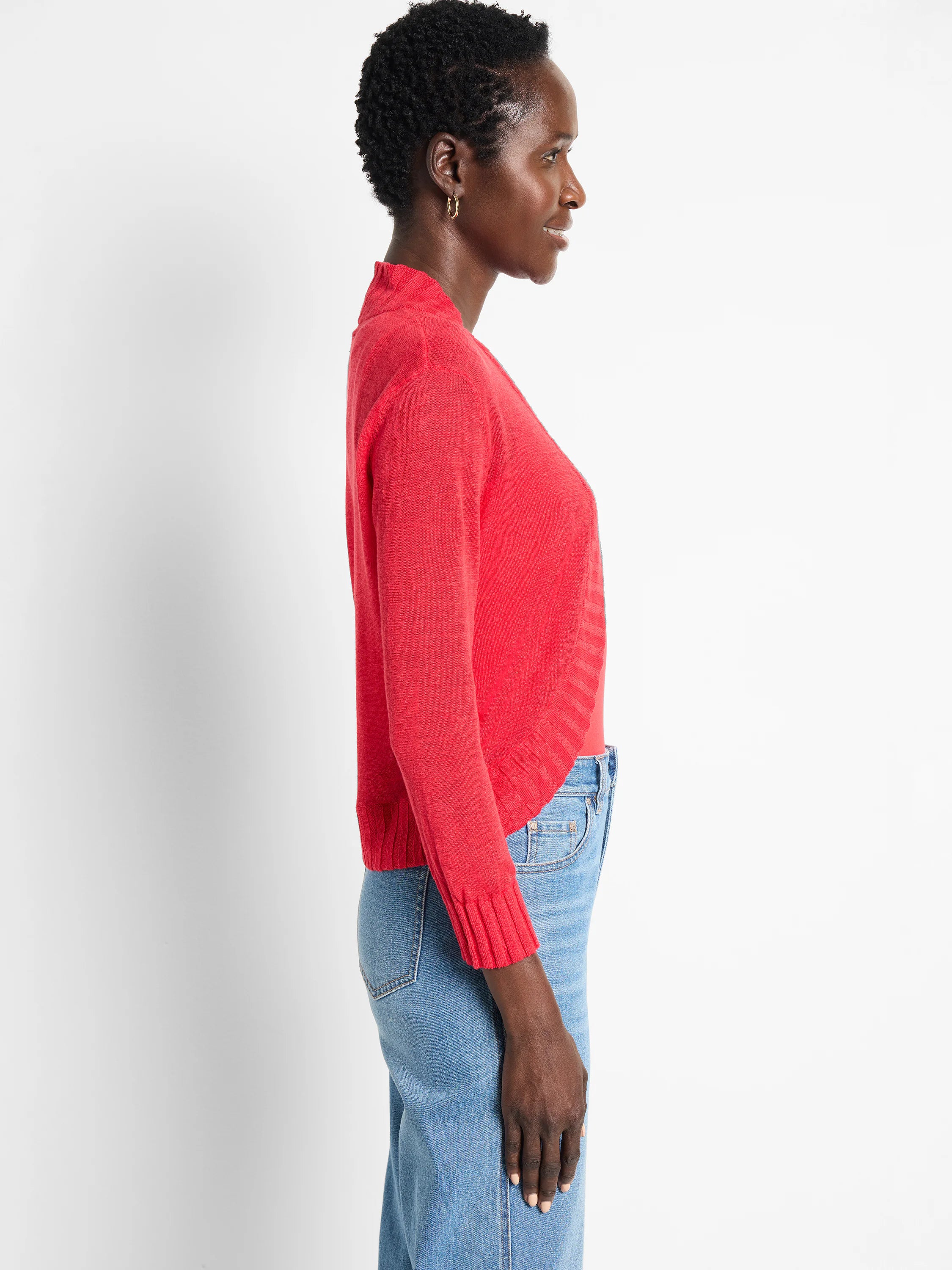 Red bolero cardigan with long sleeves, ribbed cuffs, and an open front.