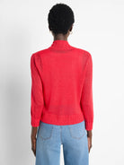 Red knit bolero cardigan, mock neck, 3/4 sleeves, ribbed hem, cropped, shown from back.