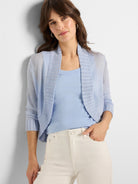 Light blue sheer knit bolero cardigan, open front, with a ribbed shawl collar and ribbed cuffs.