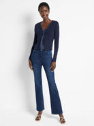 Dark navy ribbed cardigan with long sleeves, a short length, and a decorative front clasp.