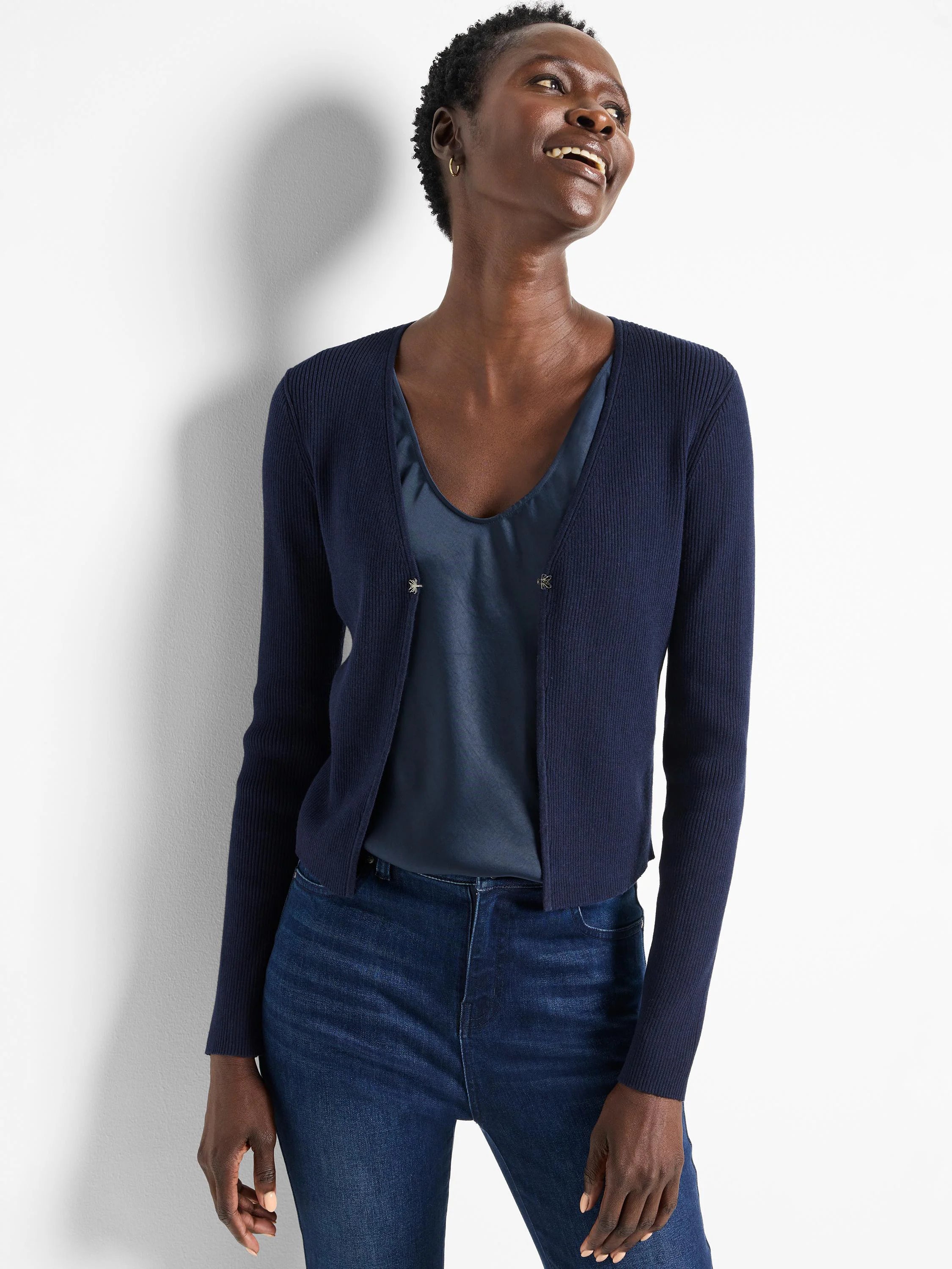 Dark navy blue ribbed knit cardigan with long sleeves and an open front, featuring two decorative clasps.