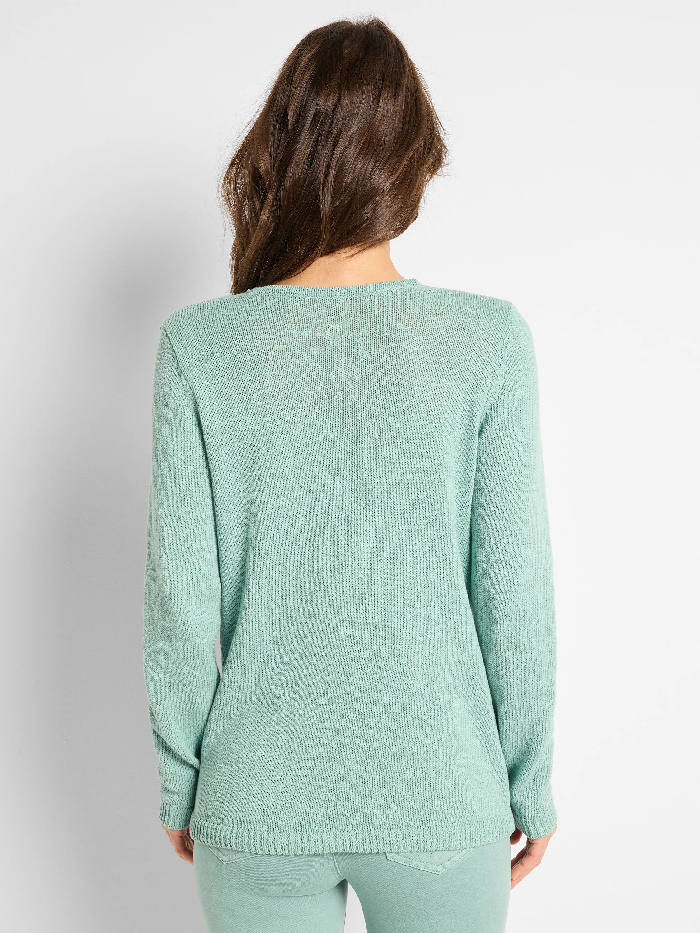 Mint green cotton cord knit sweater, back view. Round neck, long sleeves, ribbed cuffs & hem.