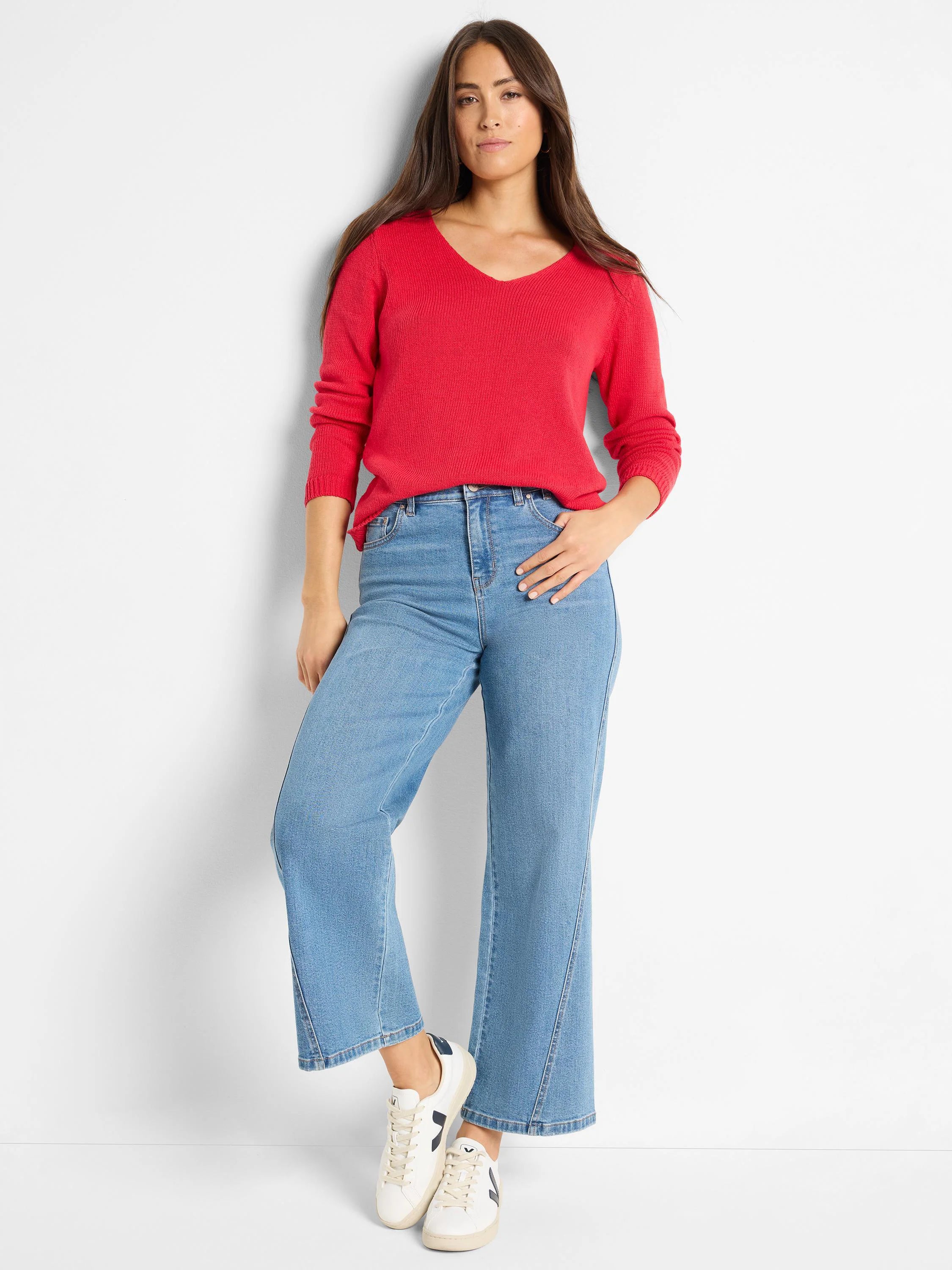 Red V-neck sweater with a visible ribbed knit texture.