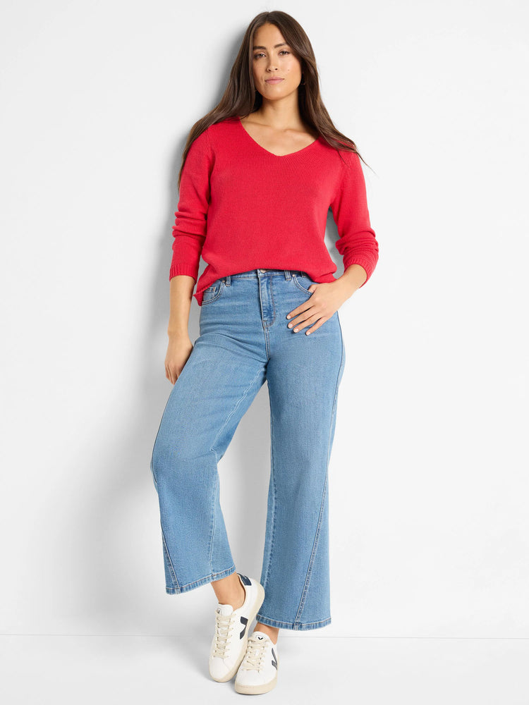 Red V-neck sweater with a visible ribbed knit texture.