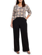 Beige sweater with dark brown circular pattern, V-neck, long sleeves.