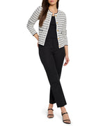 Cream and black tweed sweater jacket with dark trim, round neck, and gold buttons.