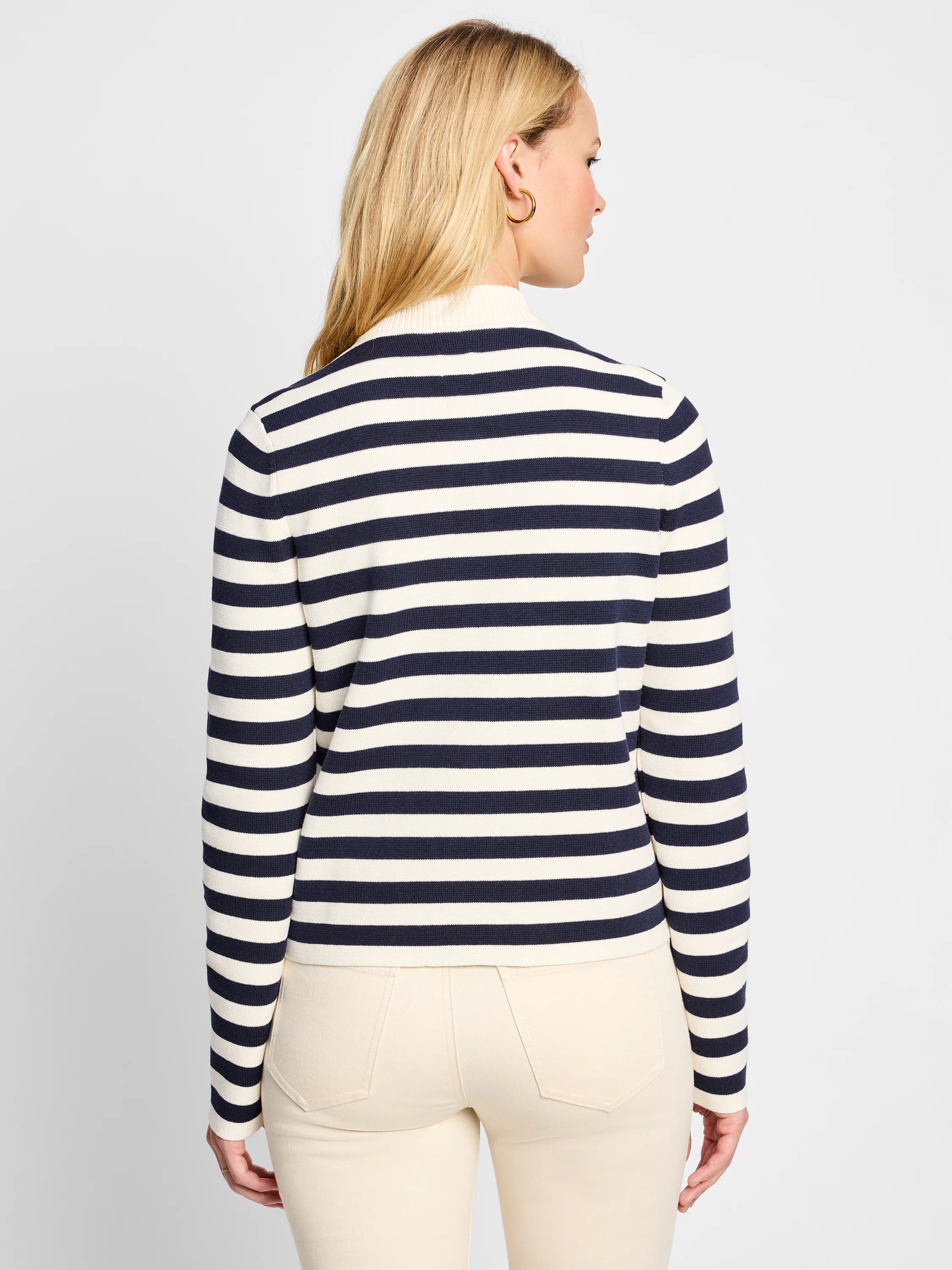 Cream and navy blue horizontally striped knit bomber jacket.  Long sleeves, mock neck.