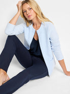 Light blue weave mix knit zip jacket with a round neck, open zipper, and two front pockets.