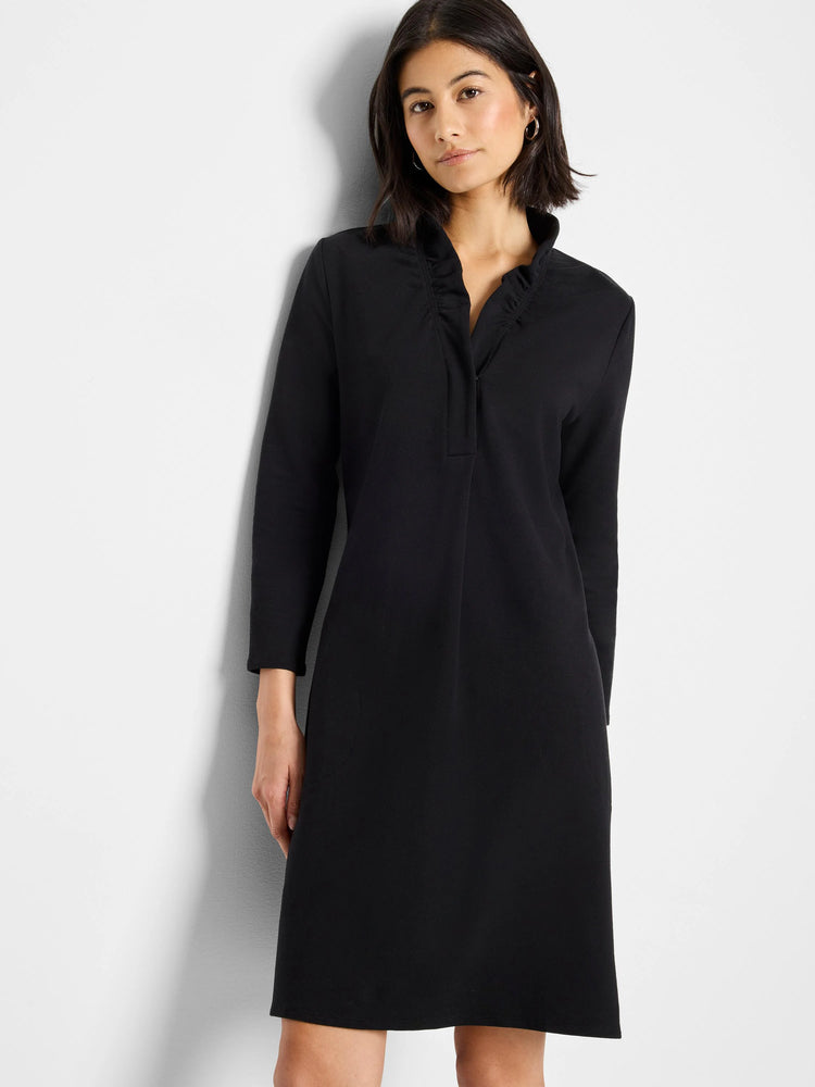 Black knit dress, ruffled collar, three-quarter sleeves, knee-length.