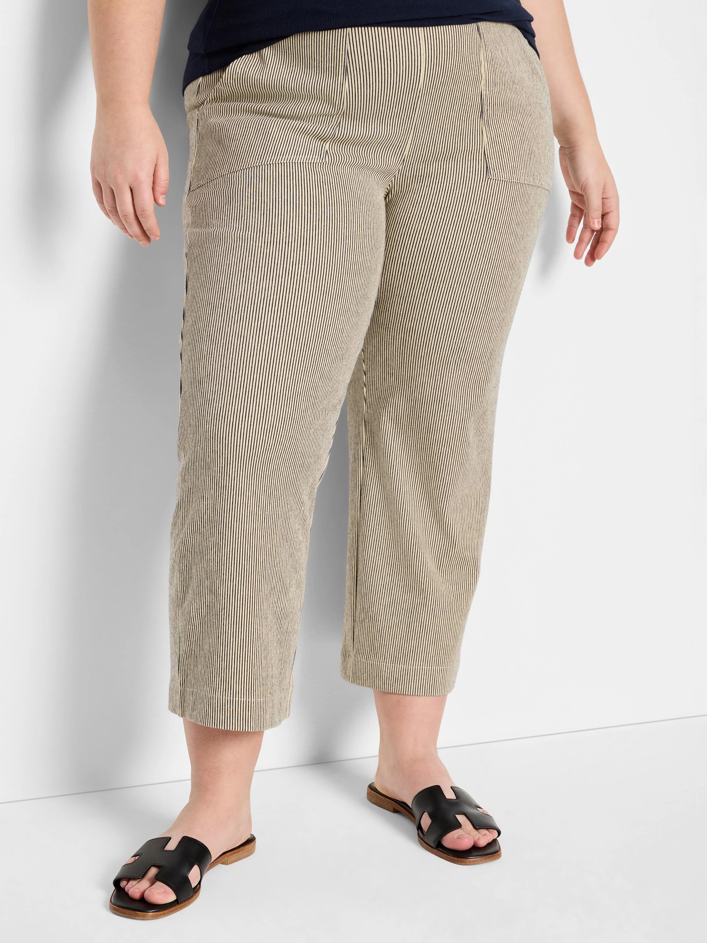 Beige wide-leg jeans with thin dark vertical stripes, cropped length, and front slash pockets.