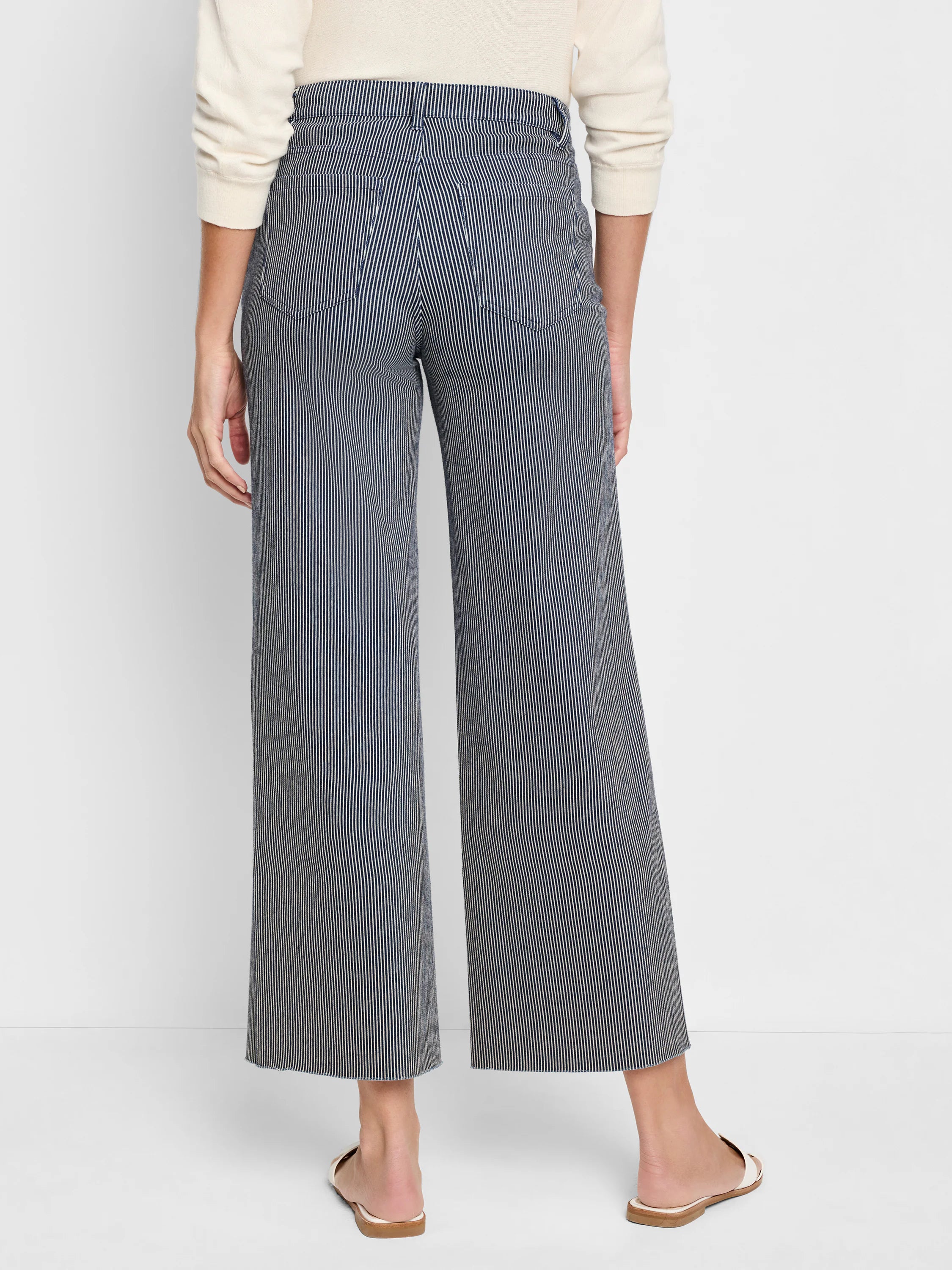 Wide-leg jeans; navy blue and white vertical stripes; raw hem.