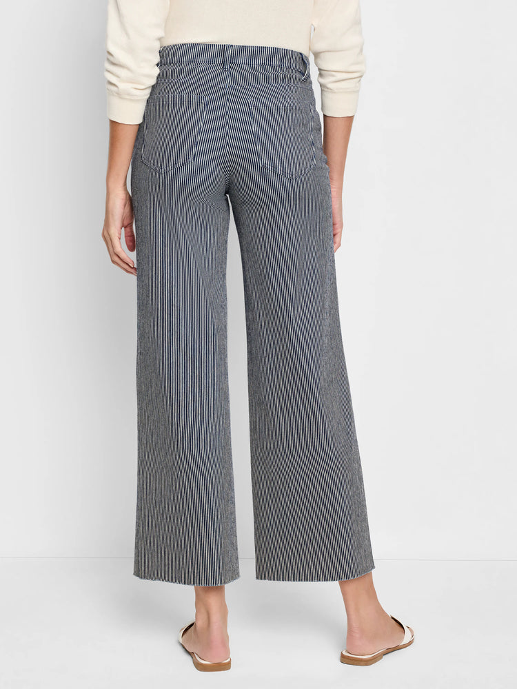 Wide-leg jeans; navy blue and white vertical stripes; raw hem.