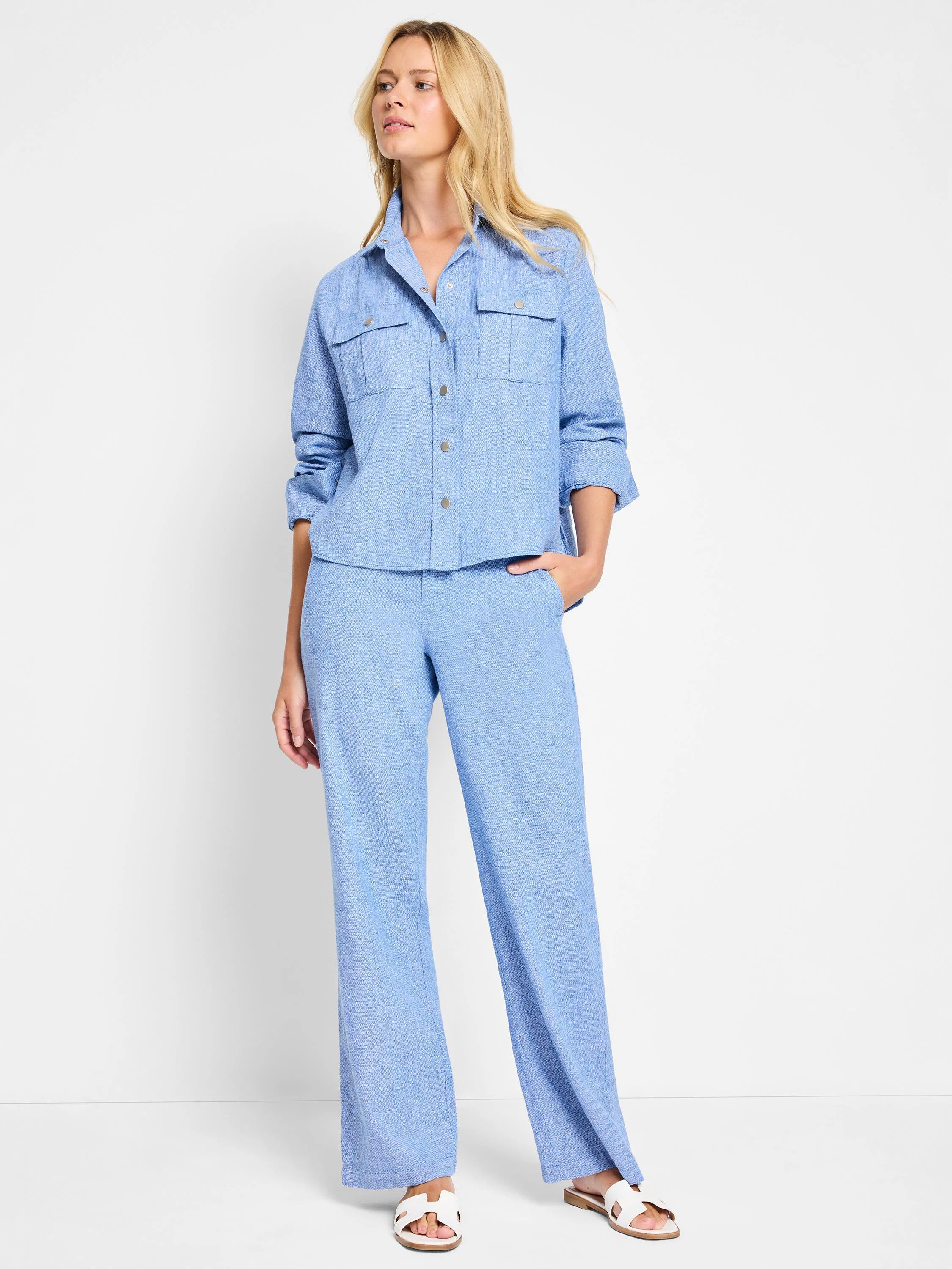 Light blue shirt jacket and pants.  The jacket has button closure and pockets.  The pants are wide-leg.