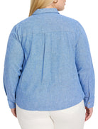 Light blue, textured shirt jacket; long sleeves, collared.  Back view.