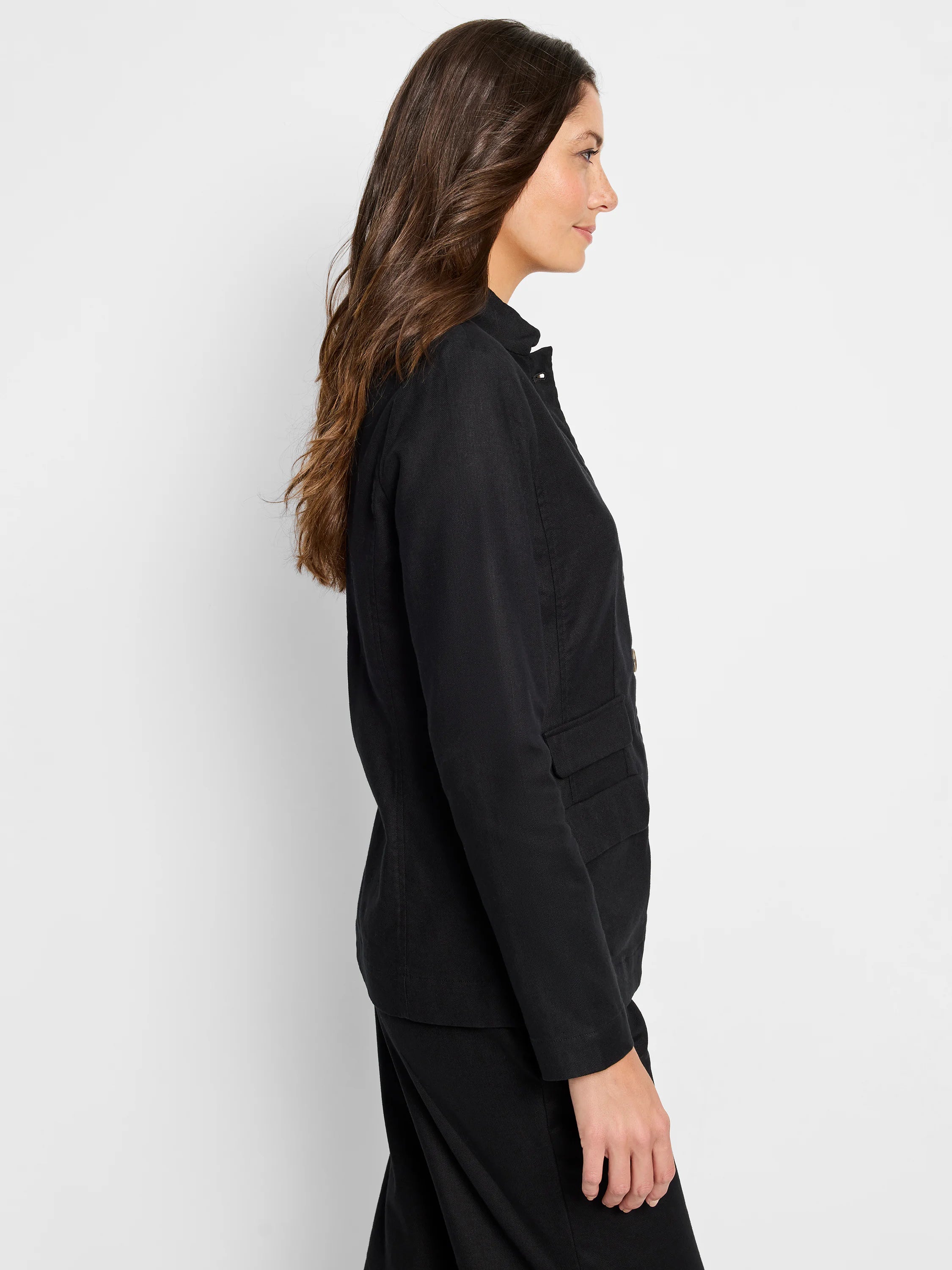 Black linen-cotton blazer.  Side profile shows long sleeves, collared neckline, and  front pockets.