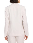 Off-white linen-cotton blazer, long sleeves, collared, shown from the back.
