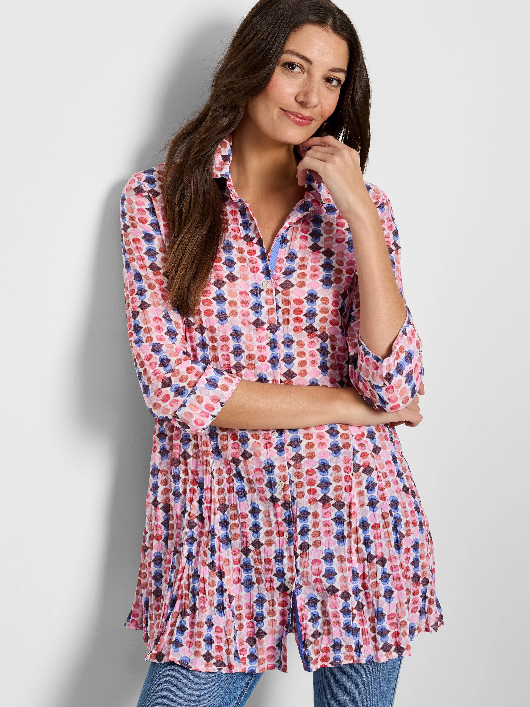 Pink, red, and blue patterned shirt; 3/4 sleeves; button-down; pleated hem.