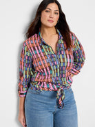 Long-sleeve button-down shirt with multicolored vertical stripes.  Predominant colors: pink, teal, brown, black. ...