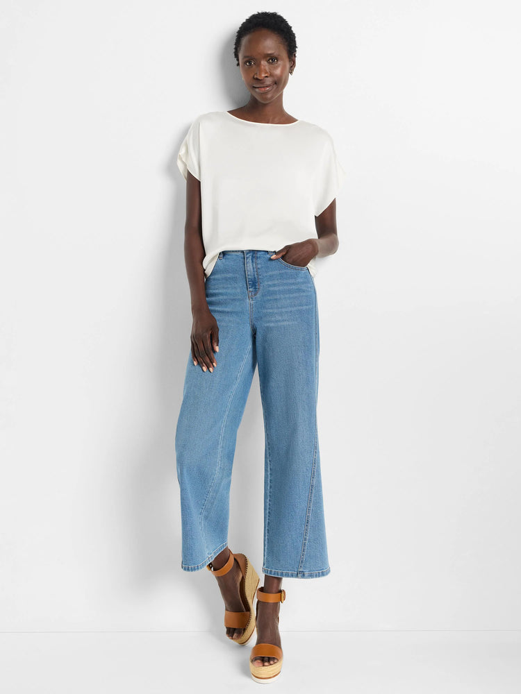 Off-white woven tee with boat neck, short wide sleeves, and subtle sheen.