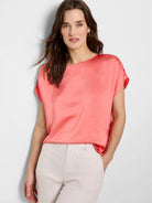 Coral pink, short-sleeved woven top.  Round neckline.  Shiny, satin-like texture.