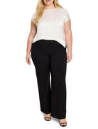 Off-white short-sleeved top, black wide-leg pants. Model shown.