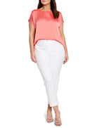 Glossy coral woven tee with a boat neck and short sleeves.