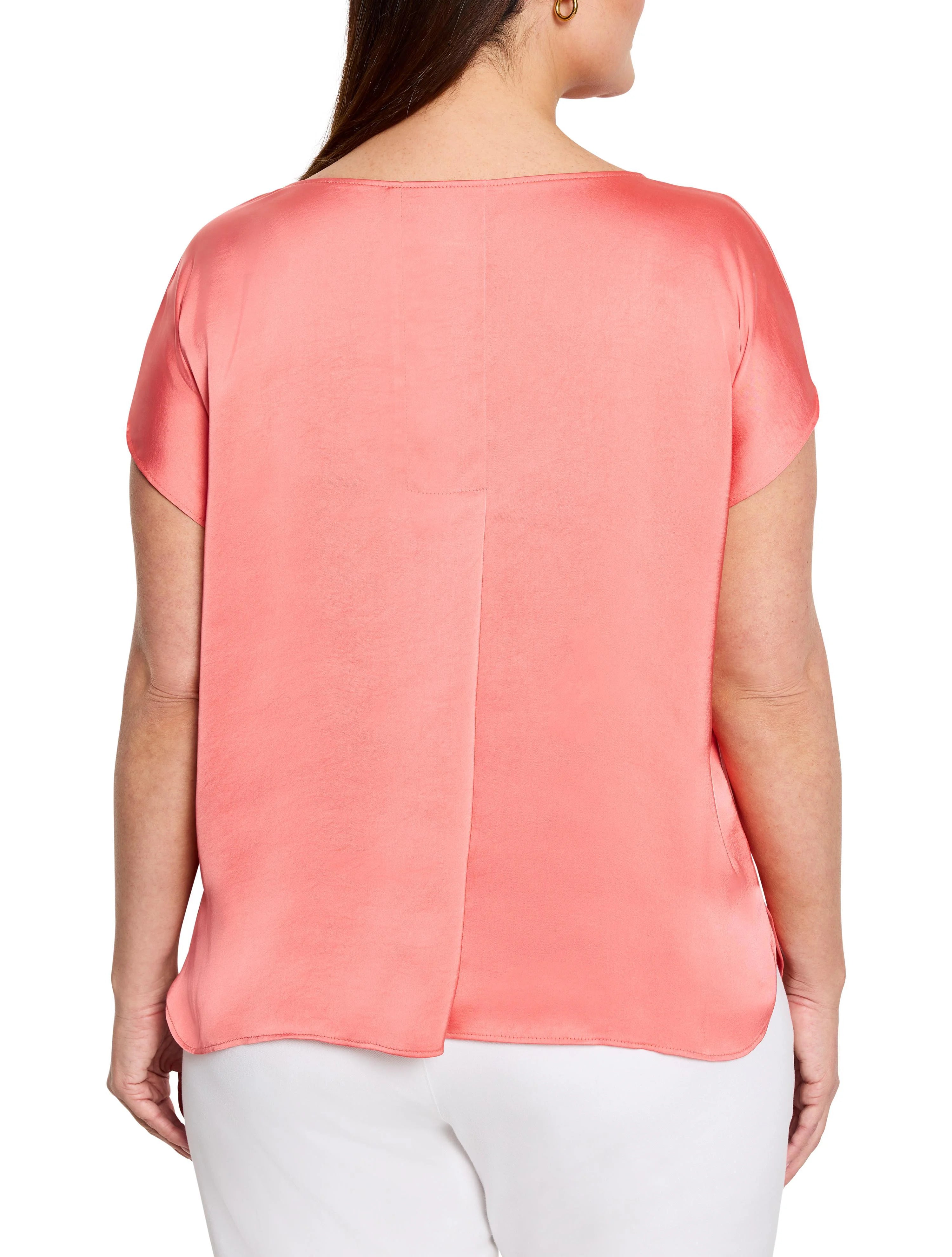 Coral glossy woven tee, back view. Features a boat neck, wide cap sleeves, curved hem, and subtle vertical back seam.