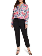 Pink, teal, and purple abstract floral print long-sleeve blouse with a V-neck.