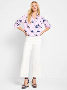 Pink & navy shirt with thin stripes and irregular dark blue stamped pattern.  Long sleeves, button-down collar.