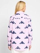 Pink & navy blue striped shirt.  Features a repeating stamped pattern. Long sleeves, button front.